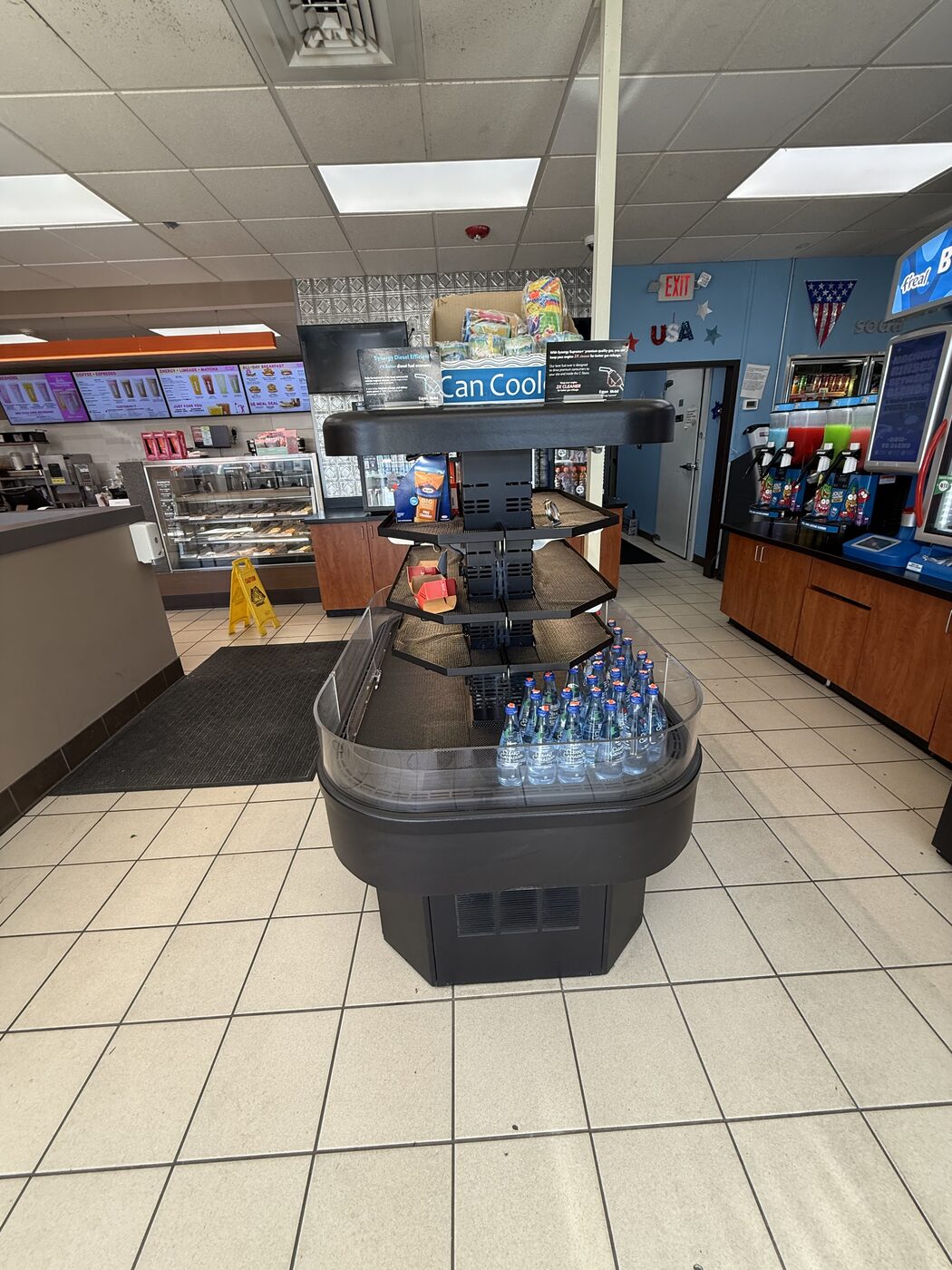 Refrigerated grab-and-go beverage display case in a convenience store