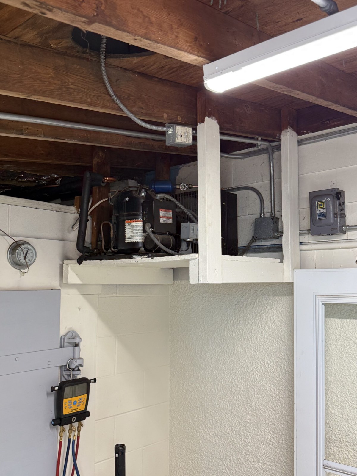 Compressor unit mounted in ceiling space — commercial refrigeration repair, Armus Refrigeration (MA & RI)