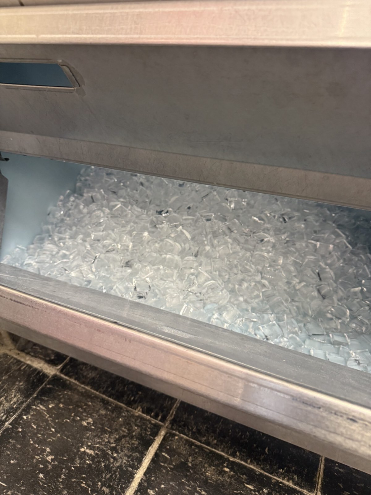 Commercial ice bin filled with clear ice cubes — commercial ice machine repair, Armus Refrigeration (MA & RI)