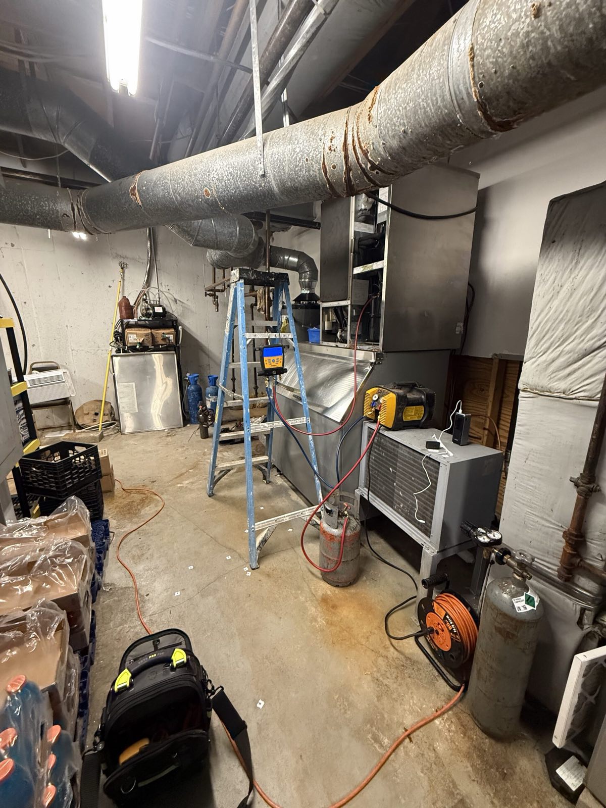 HVAC technician servicing commercial refrigeration unit — commercial refrigeration service, Armus Refrigeration (MA & RI)
